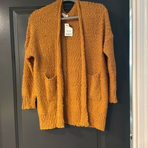 Comfy cardigan. Mustard color. Pockets! Hangs past the hips